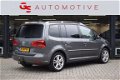 Volkswagen Touran - 1.2 TSI Highline BlueMotion 105PK met navi, pdc, lmv, bt telefoon, camera e nw a - 1 - Thumbnail