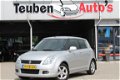 Suzuki Swift - 1.3 Exclusive airco, radio cd speler, elektrische ramen, trekhaak, lichtmetalen wiele - 1 - Thumbnail