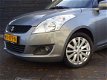 Suzuki Swift - 1.2 Exclusive EASSS Clima/Cruisecontrol/LM/ APK 30-9-2020 - 1 - Thumbnail