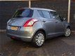 Suzuki Swift - 1.2 Exclusive EASSS Clima/Cruisecontrol/LM/ APK 30-9-2020 - 1 - Thumbnail