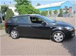 Kia Cee'd Sporty Wagon - 1.4 CVVT X-ecutive - 1 - Thumbnail