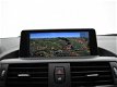 BMW 1-serie - 114I SPORT LINE + LEDER / SPORTSTOELEN / NAVI PRO / XENON - 1 - Thumbnail