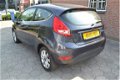 Ford Fiesta - 1.25 Titanium 1e eigenaar 2009 87.000 km abs airco stoelverwarming velgen radio cd ele - 1 - Thumbnail