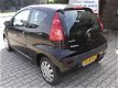 Peugeot 107 - 1.0-12V XR airco, km stand gegarandeerd met boekjes - 1 - Thumbnail