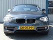 BMW 1-serie - 116d Executive /Gr Navi/Bi-Xenon/Sport int/ NL auto/100% onderhouden - 1 - Thumbnail