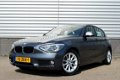 BMW 1-serie - 114i Upgrade Edition RIJKLAAR PRIJS-GARANTIE Leder interieur Navigatie Xenon - 1 - Thumbnail