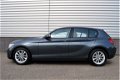 BMW 1-serie - 114i Upgrade Edition RIJKLAAR PRIJS-GARANTIE Leder interieur Navigatie Xenon - 1 - Thumbnail