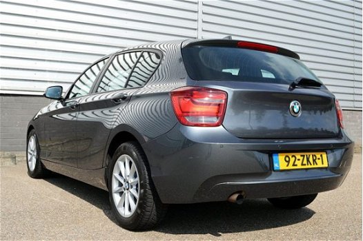 BMW 1-serie - 114i Upgrade Edition RIJKLAAR PRIJS-GARANTIE Leder interieur Navigatie Xenon - 1