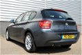 BMW 1-serie - 114i Upgrade Edition RIJKLAAR PRIJS-GARANTIE Leder interieur Navigatie Xenon - 1 - Thumbnail