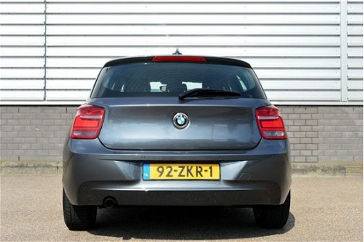 BMW 1-serie - 114i Upgrade Edition RIJKLAAR PRIJS-GARANTIE Leder interieur Navigatie Xenon - 1