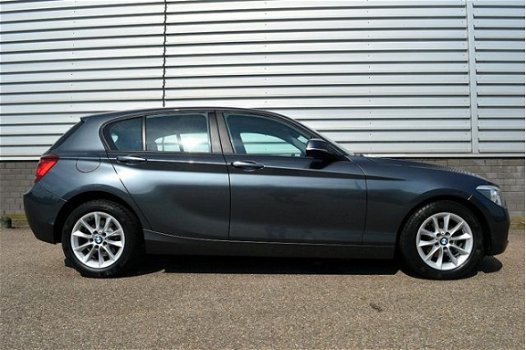 BMW 1-serie - 114i Upgrade Edition RIJKLAAR PRIJS-GARANTIE Leder interieur Navigatie Xenon - 1