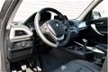 BMW 1-serie - 114i Upgrade Edition RIJKLAAR PRIJS-GARANTIE Leder interieur Navigatie Xenon - 1 - Thumbnail