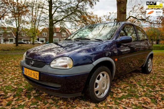 Opel Corsa - 1.2i-16V Onyx met VOL JAAR APK ( blanke lak schade ) - 1