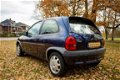 Opel Corsa - 1.2i-16V Onyx met VOL JAAR APK ( blanke lak schade ) - 1 - Thumbnail