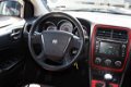 Dodge Caliber - 2.0 SPORT NAVI /TREKHAAK / WINTERSET OP LM INCL 6 MND BOVAG - 1 - Thumbnail