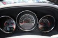 Dodge Caliber - 2.0 SPORT NAVI /TREKHAAK / WINTERSET OP LM INCL 6 MND BOVAG - 1 - Thumbnail