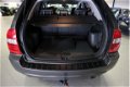 Kia Sportage - 2.0 CVVT Comfort 4WD / LEER / CLIMA / DAK DRAGERS / STOER - 1 - Thumbnail