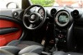 Mini Mini Countryman - S / 184 PK / 4x4 / Aut / Navi / Xenon / Parkeersensoren / F1 flipppers - 1 - Thumbnail