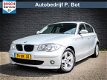 BMW 1-serie - 120i High Executive Automaat / Cruise / PDC / Clima - 1 - Thumbnail