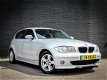 BMW 1-serie - 120i High Executive Automaat / Cruise / PDC / Clima - 1 - Thumbnail