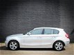 BMW 1-serie - 120i High Executive Automaat / Cruise / PDC / Clima - 1 - Thumbnail