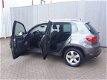 Volkswagen Tiguan - 1.4 TSI Edition RIJKLAAR 100% onderhouden airconditioning, comfortstoelen met le - 1 - Thumbnail