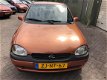 Opel Corsa - 1.2i-16V Strada deze auto heeft een nieuwe apk met airco - 1 - Thumbnail