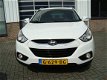 Hyundai ix35 - DYNAMIC MPV HOGE INSTAP NAVIGATIE CAMERA ECC CRUISE LMV PDC HALF LEDER TREKHAAK - 1 - Thumbnail