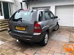 Kia Sportage - 2.0 CVVT | 4WD | Cruise | Half-leer | Trekh | Airco - 1 - Thumbnail