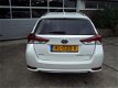 Toyota Auris Touring Sports - 2015 1.8 Hybrid Executive, 1e Eigenaar, Dealer onderhouden, Bouwjr.12- - 1 - Thumbnail