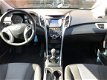 Hyundai i30 - 1.6 GDI i-Drive Cool Plus - parkeersensoren voor & achter, airco, sportieve lichtmetal - 1 - Thumbnail