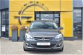 Opel Astra Sports Tourer - 1.4 Turbo Berlin+ | AGR-comfortstoelen | Lichtmetalen Velgen | Cruise Con - 1 - Thumbnail