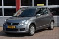 Suzuki Swift - 1.3 Comfort - 1 - Thumbnail