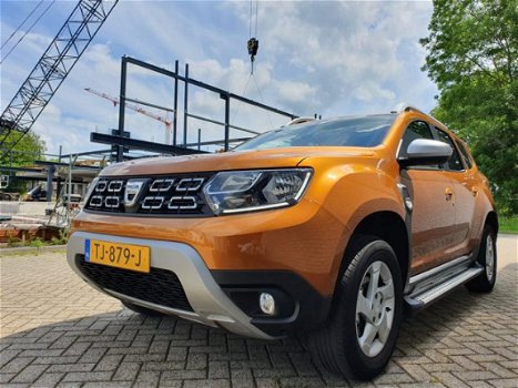 Dacia Duster - TCe 125 Comfort | inclusief gratis rijklaarpakket twv € 695, - (foto 2) | Hoge instap - 1