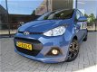 Hyundai i10 - 1.0i 66pk Blue 4pl. Comfort Climate en LM velgen - 1 - Thumbnail