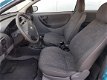 Opel Corsa - 1.0-12V Comfort - 1 - Thumbnail