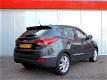 Hyundai ix35 - 2.0i 4WD i-Catcher (panodak, xenon, navi, camera) - 1 - Thumbnail