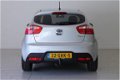 Kia Rio - 1.2 CVVT Plus Pack | RADIO-NAVIGATIE | AIRCO | CRUISE-CONTROL | 17 INCH | TREKHAAK | DONKE - 1 - Thumbnail