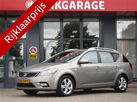 Kia Cee'd - 1.4 CVVT Navigator Plus Pack | CLIMA AIRCO | NAVIGATIE + BLUETOOTH | TREKHAAK | PDC | BO - 1