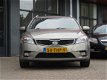 Kia Cee'd - 1.4 CVVT Navigator Plus Pack | CLIMA AIRCO | NAVIGATIE + BLUETOOTH | TREKHAAK | PDC | BO - 1 - Thumbnail