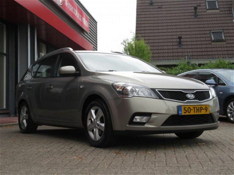 Kia Cee'd - 1.4 CVVT Navigator Plus Pack | CLIMA AIRCO | NAVIGATIE + BLUETOOTH | TREKHAAK | PDC | BO - 1