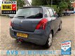 Suzuki Swift - 1.3 Shogun / Airco / Trekhaak / LMV 15inch / 5 deurs / Elek. ramen - 1 - Thumbnail