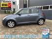 Suzuki Swift - 1.3 Shogun / Airco / Trekhaak / LMV 15inch / 5 deurs / Elek. ramen - 1 - Thumbnail