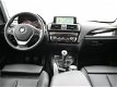 BMW 1-serie - 116D EDE SPORT + LEDER / SPORTSTOELEN / NAVI PRO / HARMAN/KARDON - 1 - Thumbnail