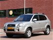 Hyundai Tucson - 2.0i Style, trekhaak, cruise-control, automatische airco - 1 - Thumbnail