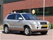 Hyundai Tucson - 2.0i Style, trekhaak, cruise-control, automatische airco - 1 - Thumbnail