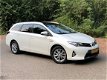 Toyota Auris Touring Sports - 1.8 Hybrid Lease Navi. / Clima / Cruise Cont. / Panorama Dak - 1 - Thumbnail