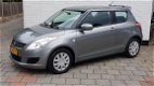 Suzuki Swift - 1.2 3drs comfort airco spioler in kleur 58000 km - 1 - Thumbnail