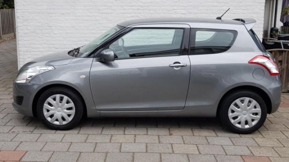 Suzuki Swift - 1.2 3drs comfort airco spioler in kleur 58000 km - 1