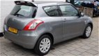 Suzuki Swift - 1.2 3drs comfort airco spioler in kleur 58000 km - 1 - Thumbnail